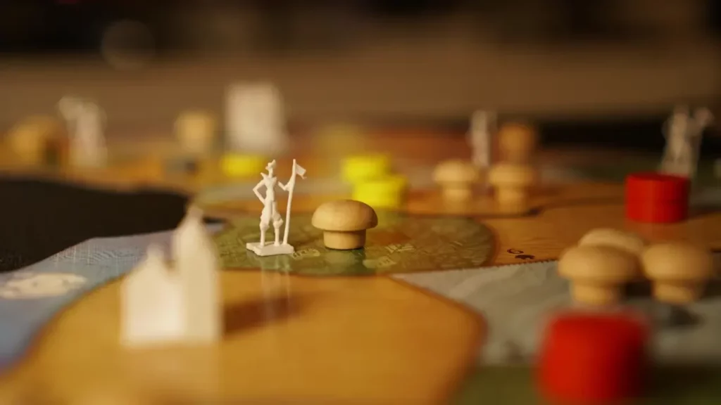 A close up of a board game with figurines on it. Themes of the link between social anxiety and TTRPG.
