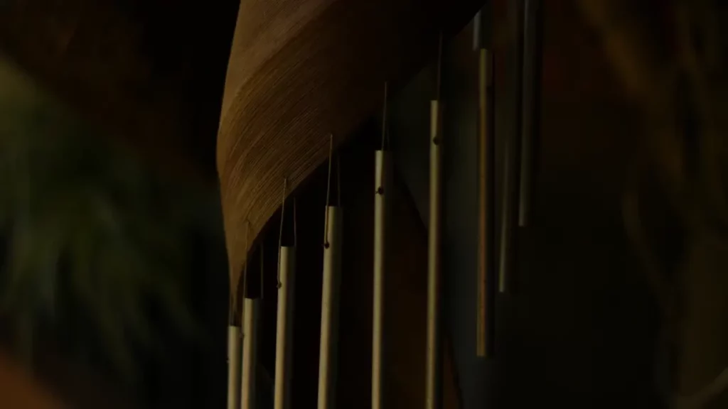 A close up of a wooden wind chime. Themes of fantasy music.