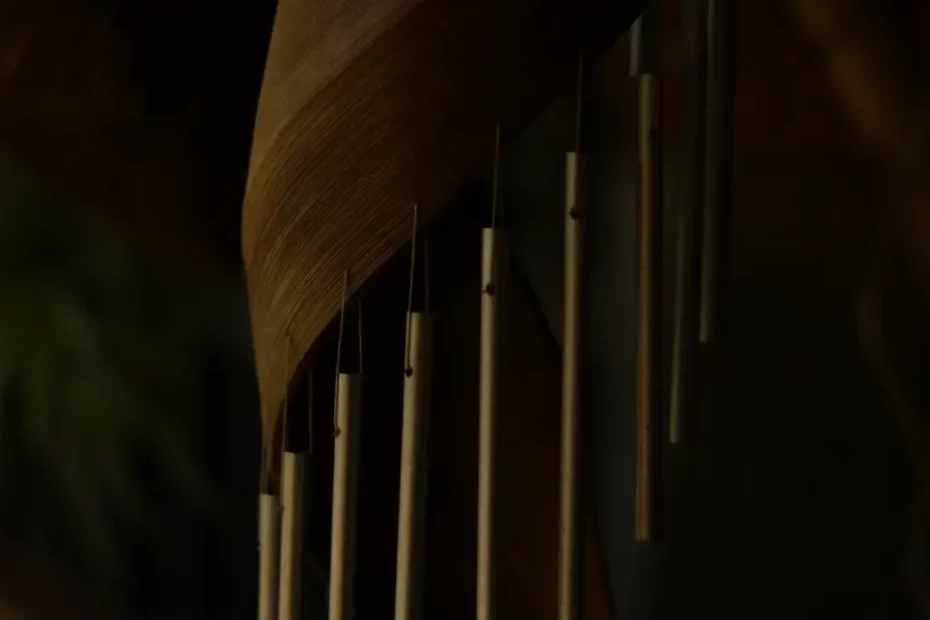 A close up of a wooden wind chime. Themes of fantasy music.