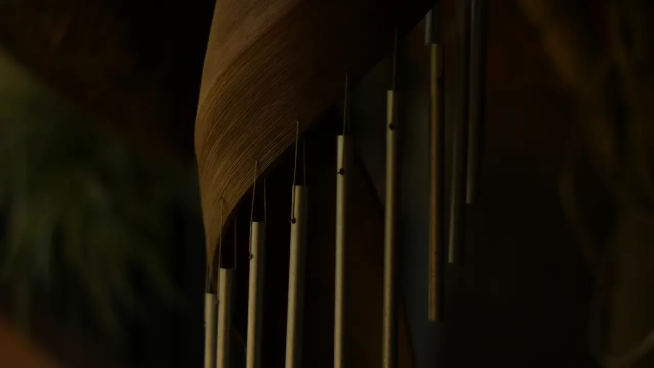 A close up of a wooden wind chime. Themes of fantasy music.