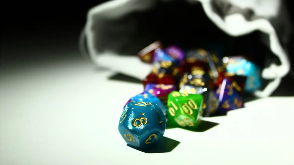 A photo of polyhedric dice on a table. Themes of paid DM.