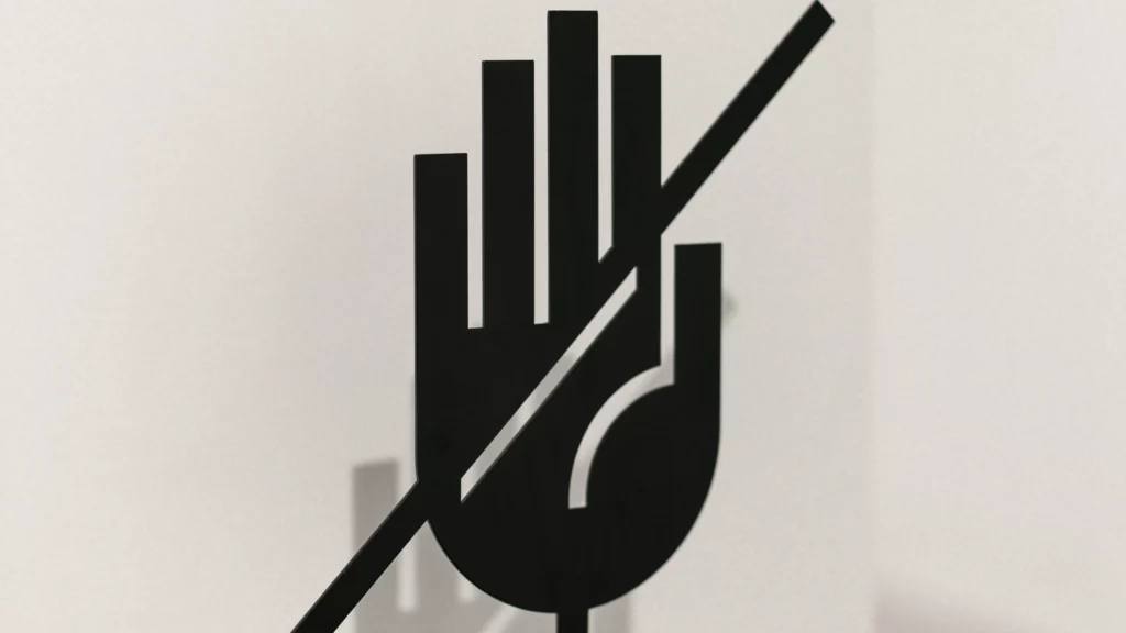 A black and white picture of a hand. Themes of resell.