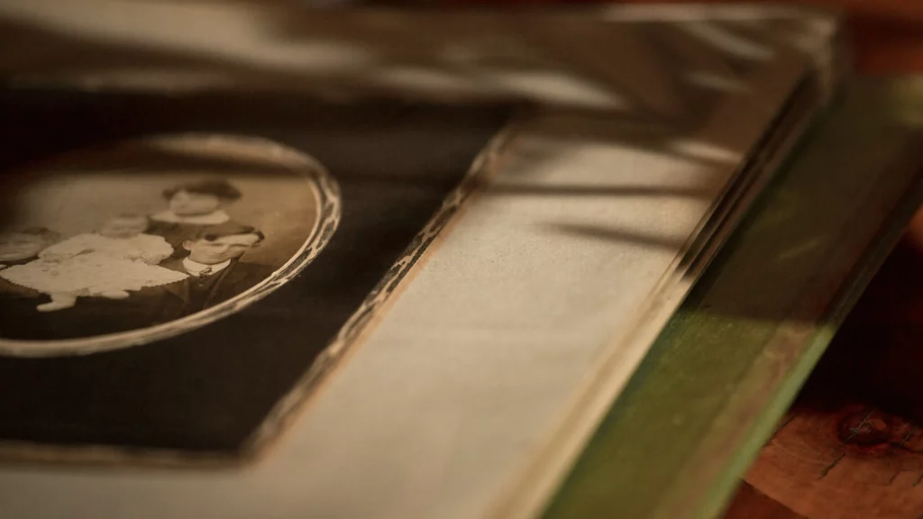 Brown and white book on red and white textile.