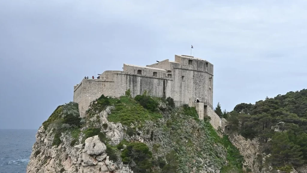 A photo of an old fort on a cliff overlooking the sea.